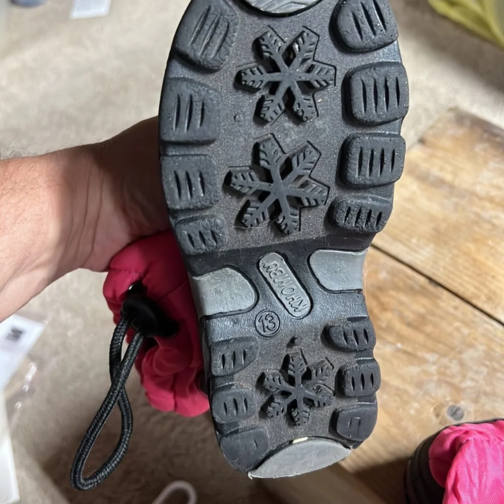 Size 13 girls winter snow boot by Khombu. Pink and black. Lightly worn.